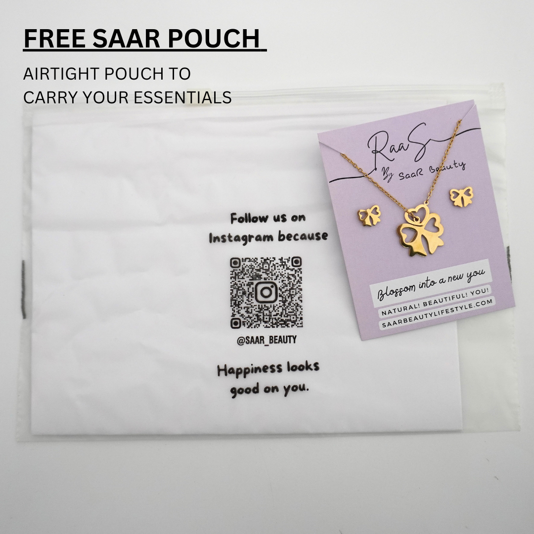 Close-up of anti-tarnish waterproof gold jewelry set featuring heart and bow designs.