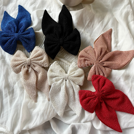 Elevate your hair game with SaaR Beauty's Rough Velvet Dual-Sided Bow Clip. This luxurious clip is an in-house creation, meticulously crafted to offer both style and durability. Made from premium rough velvet fabric, this bow clip is available in 6 timeless designs, offering a soft yet textured look that complements any outfit. Perfect for both casual outings and special occasions, the sturdy clip ensures a secure grip for all-day wear, while the dual-sided velvet provides a rich, dimensional finish. A must