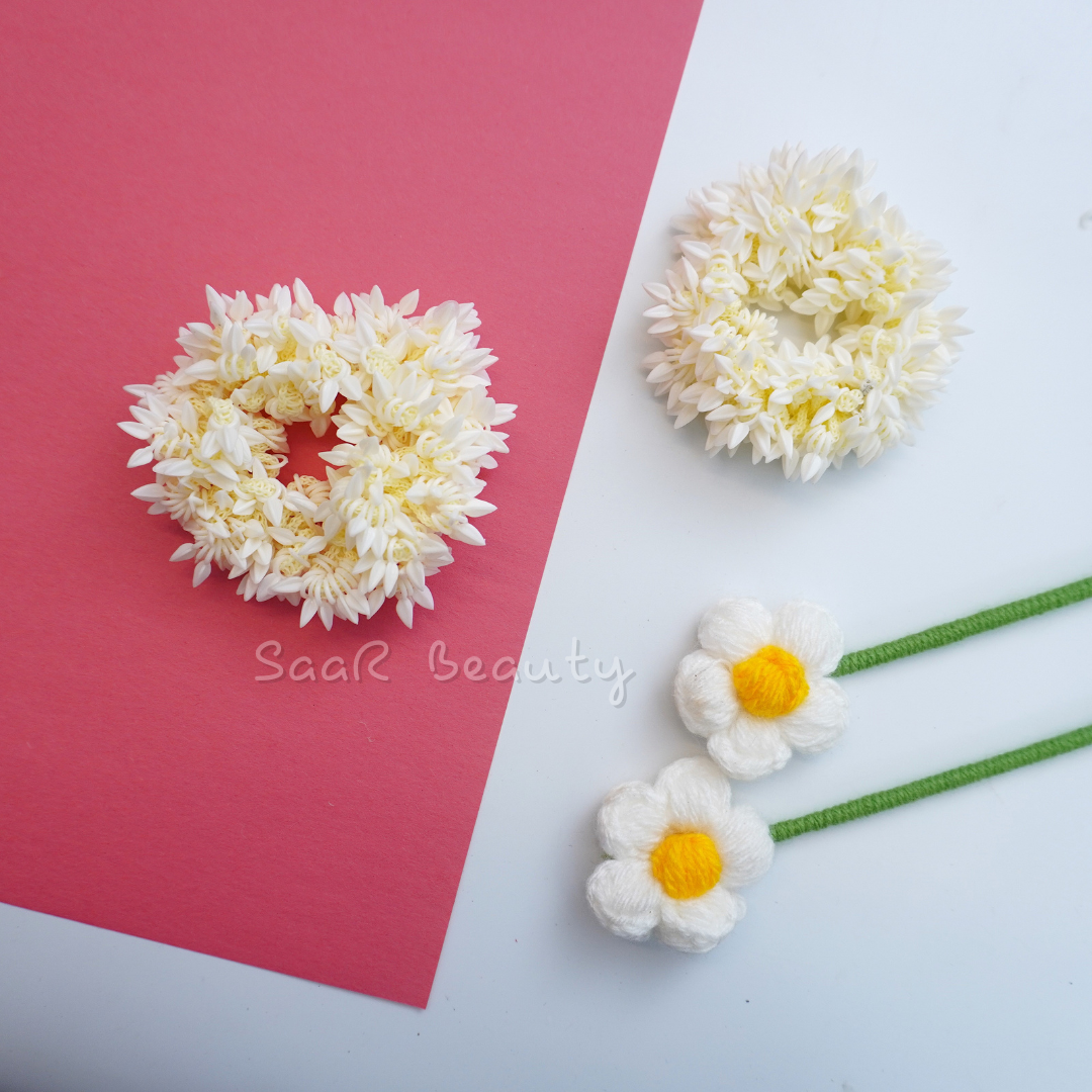 Shop the Traditional Gajra Scrunchie for weddings and festive occasions. This artificial floral accessory offers a realistic jasmine look, perfect for bun hairstyles and bridal ceremonies.
