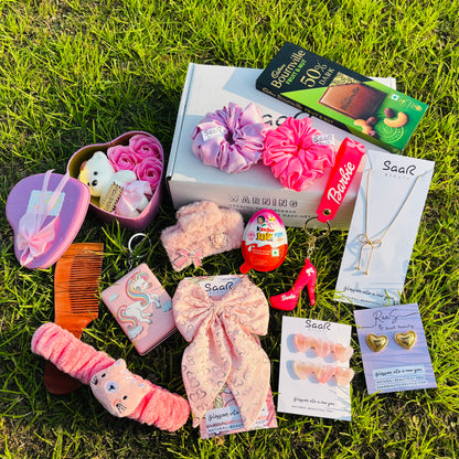 SaaR Beauty Valentine’s Gift Set – A luxury gift box featuring satin scrunchies, a necklace, earrings, chocolates, a plush headband, a heart bow clip, and more.