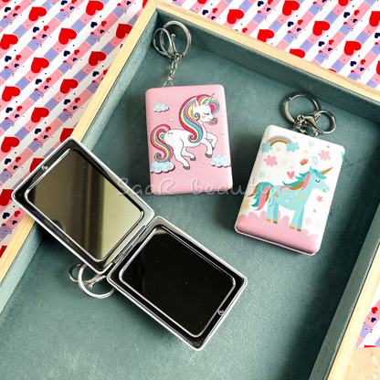 Portable unicorn-themed keychain mirrors with colorful designs, compact and lightweight, perfect for travel or daily use.