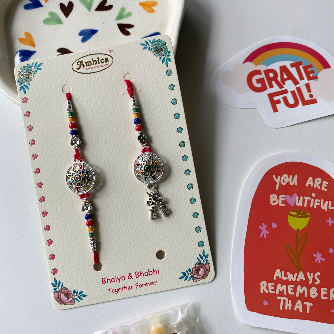 THE SURYA MANDALA KEY SNEH RAKHI FOR BHAIYA &amp; BHABHI (SET OF TWO)