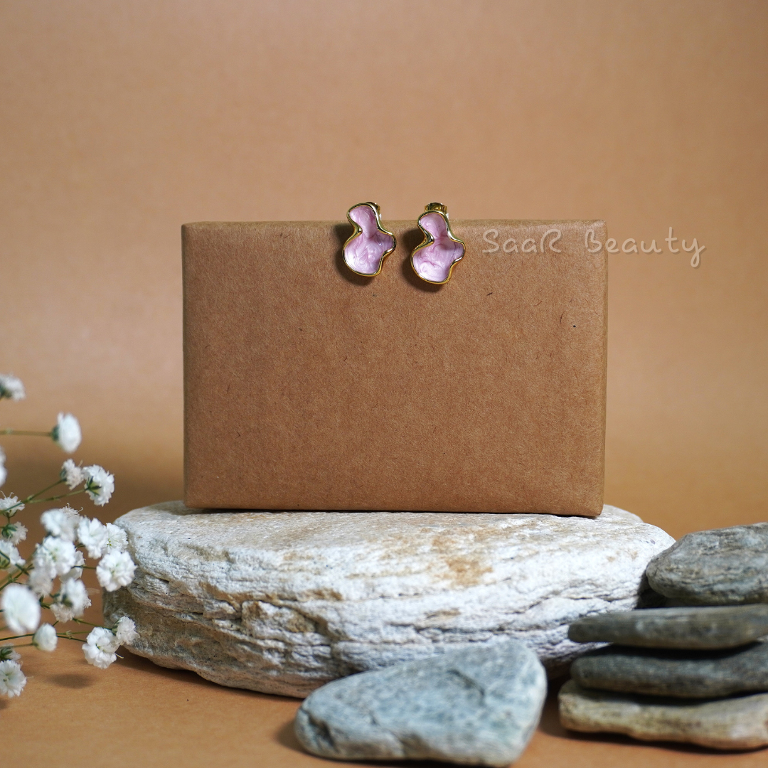 Elegant pink anti-tarnish waterproof stainless steel earrings with a soft pink hue and organic shape, perfect for women and girls, ideal for any occasion.