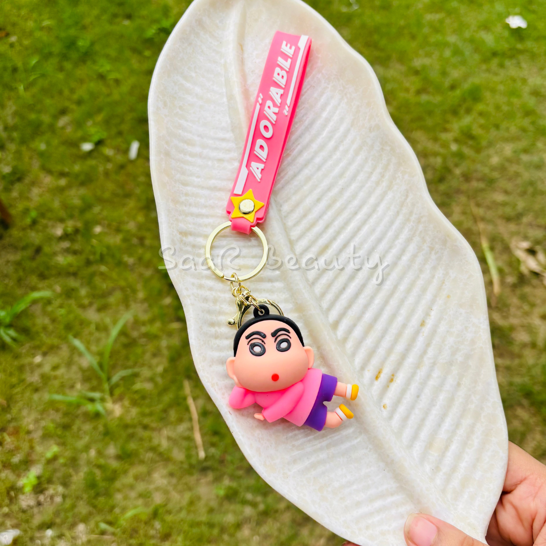Premium cute cartoon keychains by Saar Beauty featuring Hello Kitty, Shinchan, Kuromi, Starbucks drink, boba tea, and pink bow designs – durable, trendy, and stylish for women, kids, and girl