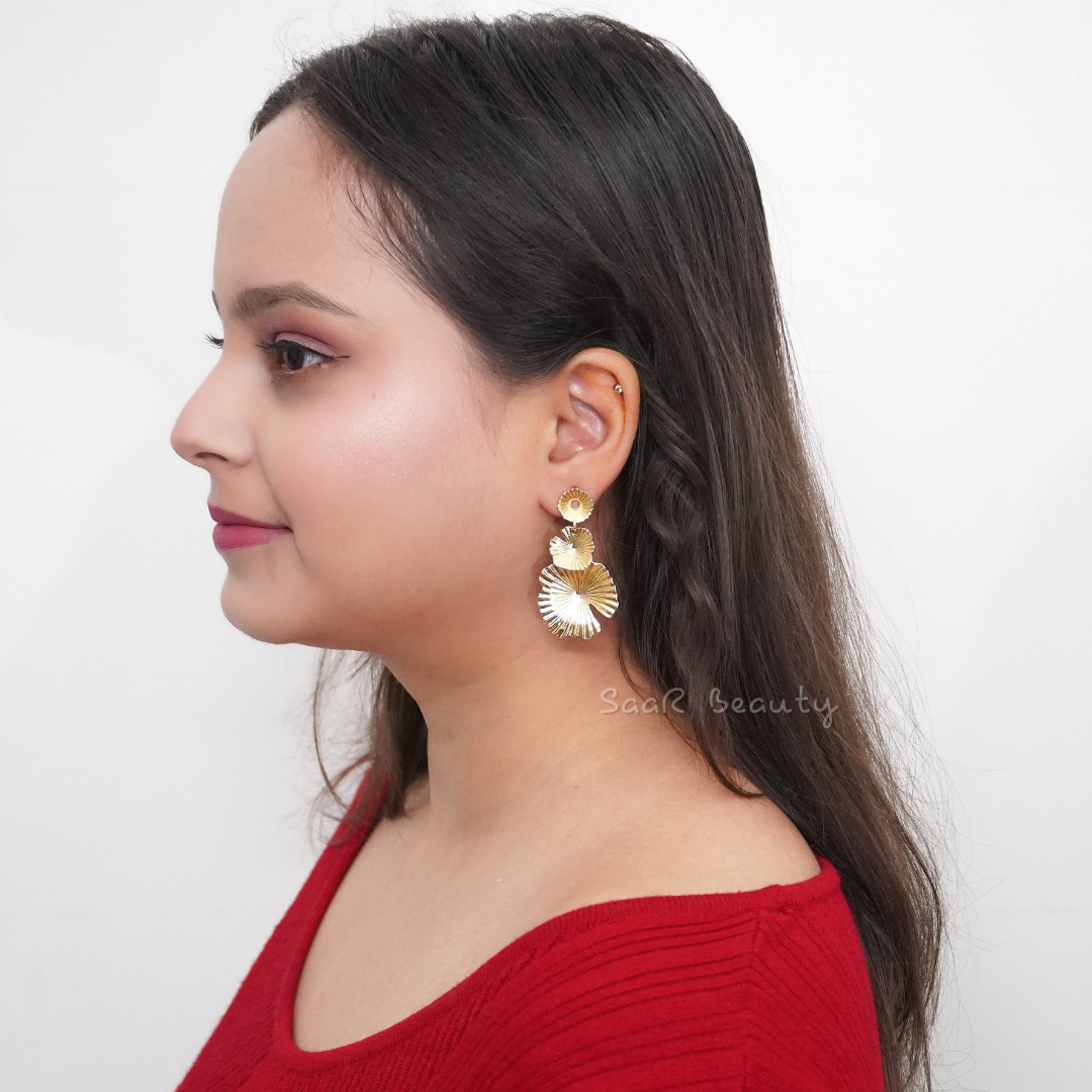 White anti-tarnish waterproof stainless steel earrings by SaaR Beauty, featuring a sleek and elegant design on a natural background.