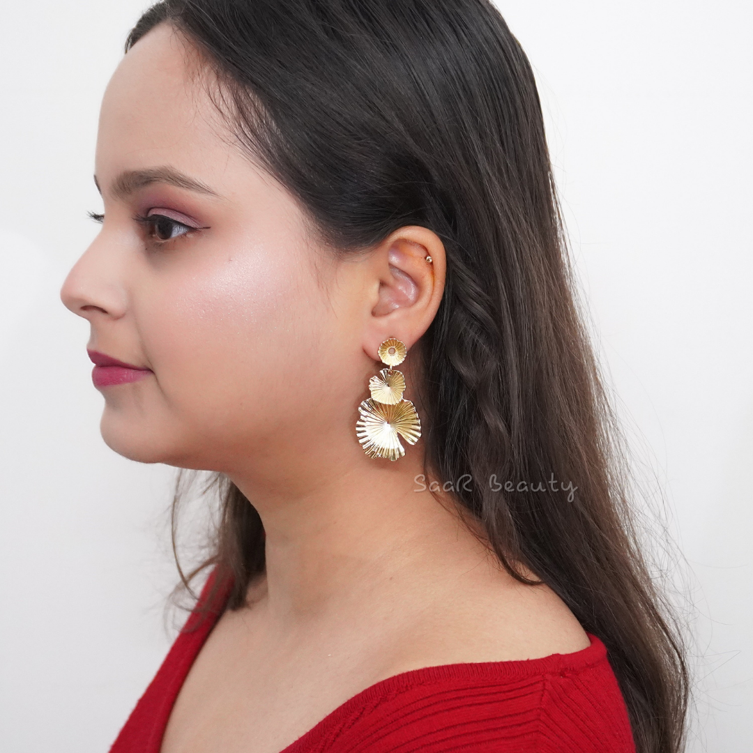 White anti-tarnish waterproof stainless steel earrings by SaaR Beauty, featuring a sleek and elegant design on a natural background.