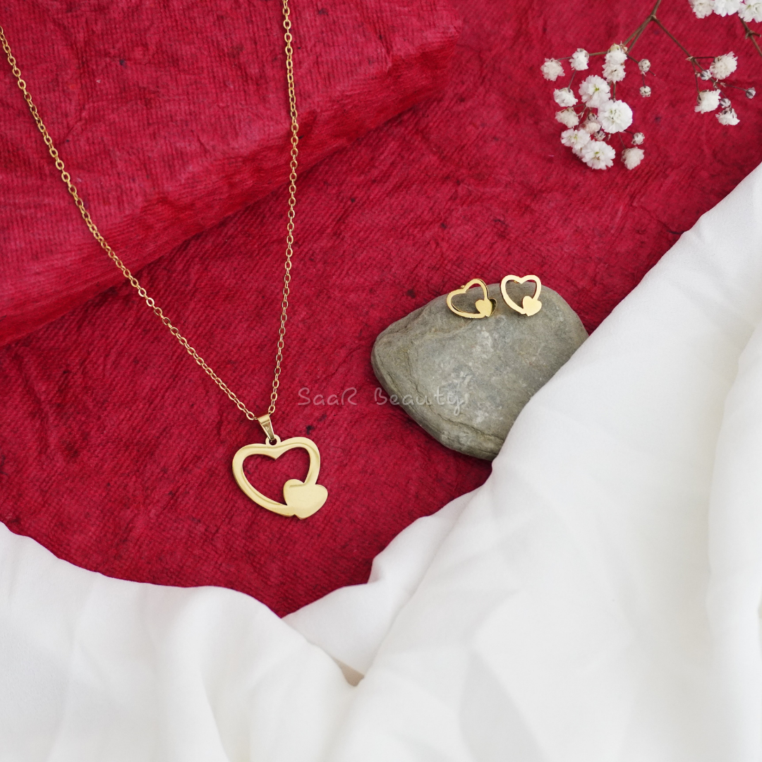 Anti-tarnish waterproof gold heart jewelry set with elegant necklace and earrings.