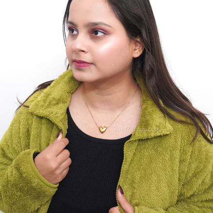 Gold heart pendant necklace by SaaR Beauty, featuring a sleek, minimalist design with anti-tarnish waterproof stainless steel and hypoallergenic properties.