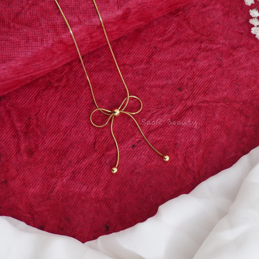 Graceful Bow Design Necklace – Cultural Charm in Gold by SaaR Beauty