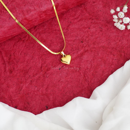 Gold Valentine heart pendant necklace with a sleek snake chain by SaaR Beauty, designed for romantic occasions with anti-tarnish and waterproof durability.