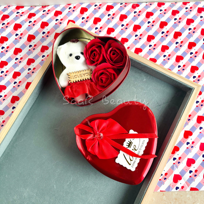 Heart-shaped Valentine’s Day gift box with a plush teddy bear, artificial roses, and an "I Love You" tag—perfect romantic gift for special occasions.