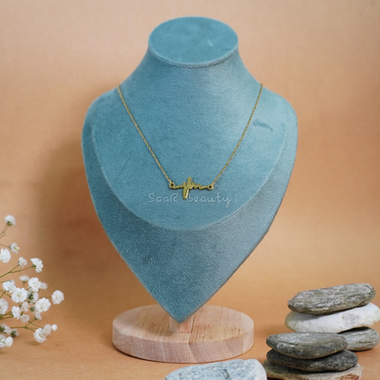 "Minimalist heartbeat pendant necklace in gold by SaaR Beauty, perfect for everyday wear and special occasions."