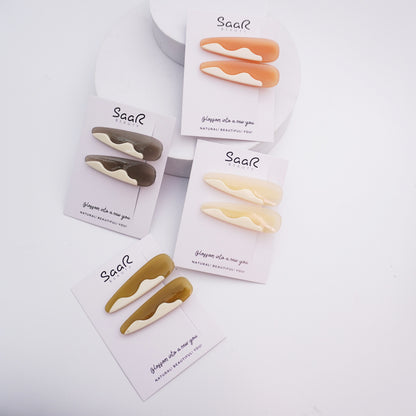 Elevate your look with SaaR Beauty's Set of 2 Oval Hair Clips! Featuring a chic milky finish, they’re durable, lightweight, and perfect for all hair types and occasions.