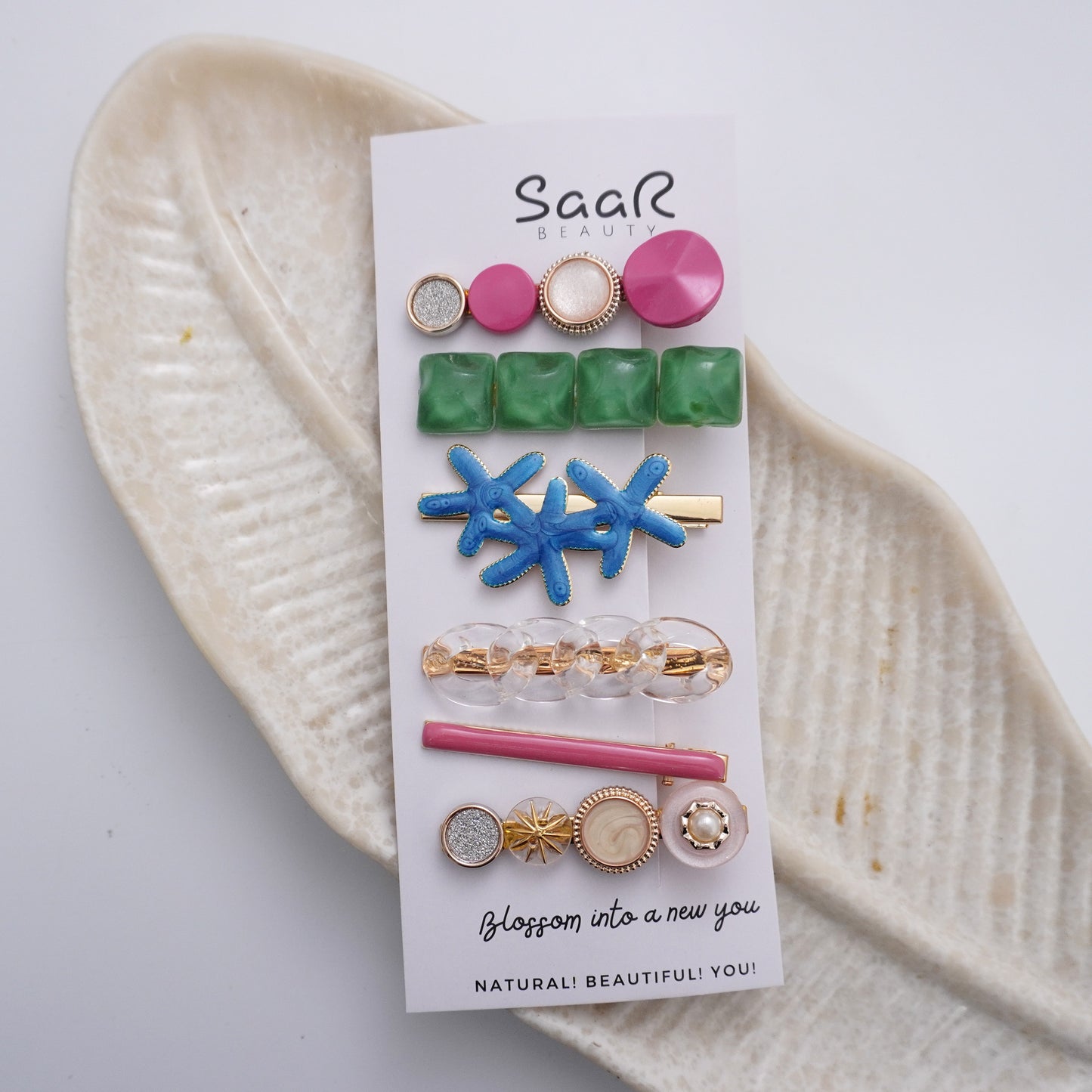 Chic chained claw hair clip by SaaR Beauty. Made from durable metal in vibrant colors. Stylish, secure, and perfect for all hair types and occasions!