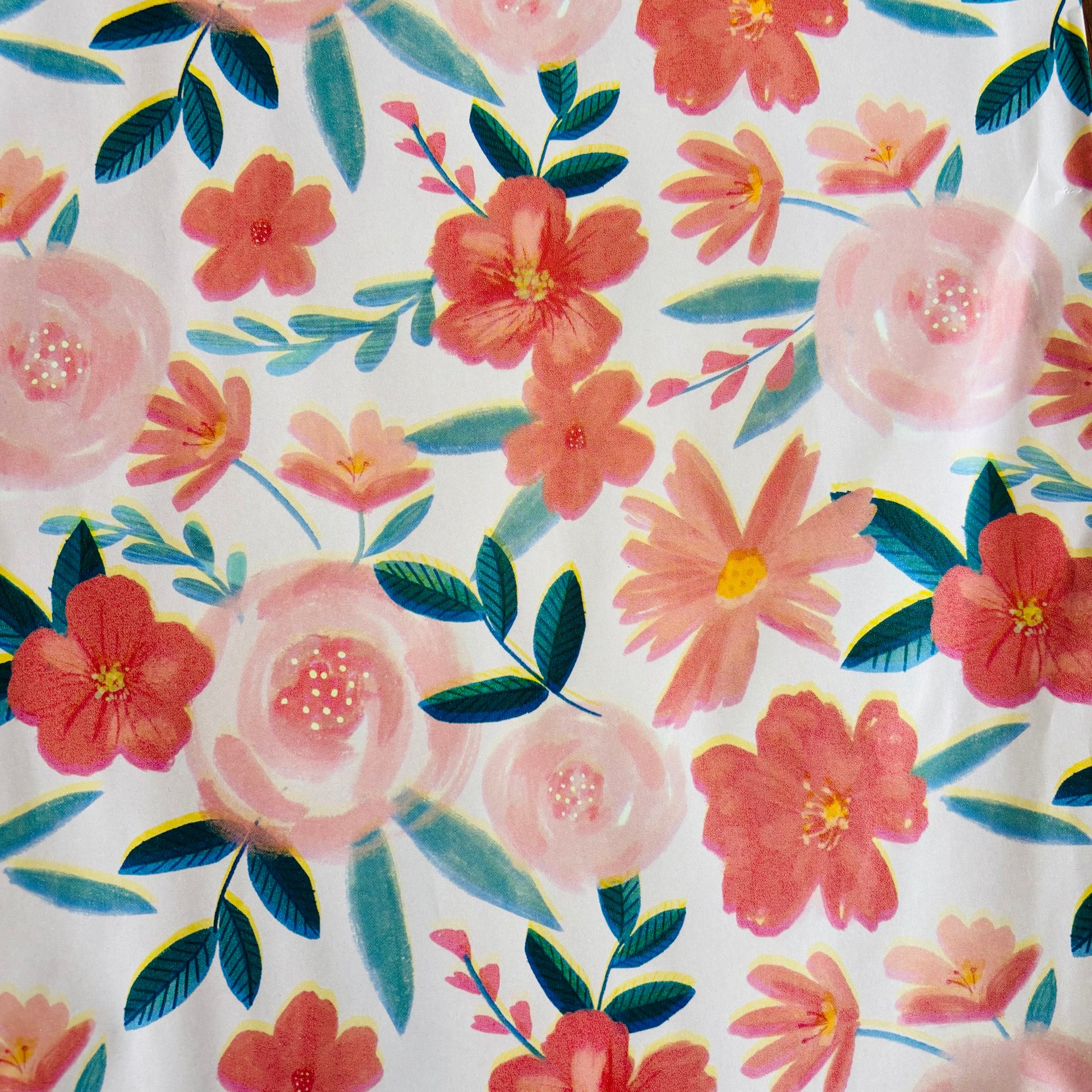 Floral pattern with pink and red flowers on a white background