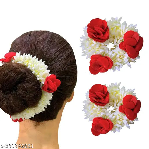 Add elegance to your hairstyle with the White Gajra Scrunchie with Red Roses. Perfect for weddings and festive occasions, this floral accessory blends jasmine and red roses for a striking traditional look.